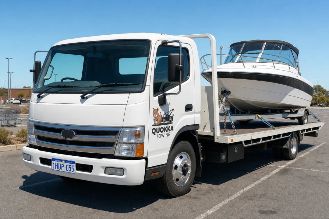 A Quokka tow truck with a boat attached representing quality Boat towing in Perth.